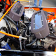 Two motorcycle engines in the rear of a Mini Pickup